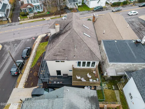 an aerial view of a house with a mountain view
