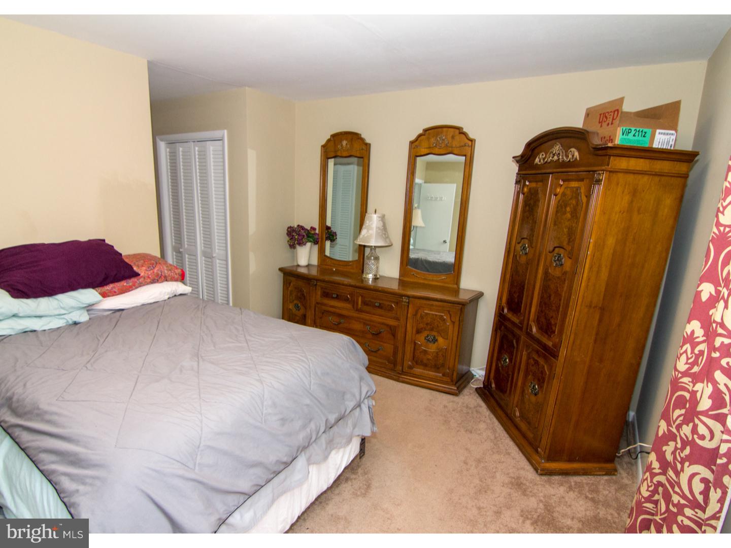 98 Georgia Road Pennsville, NJ 08070 - Photo 17 of 19 a bedroom with a bed and a dresser