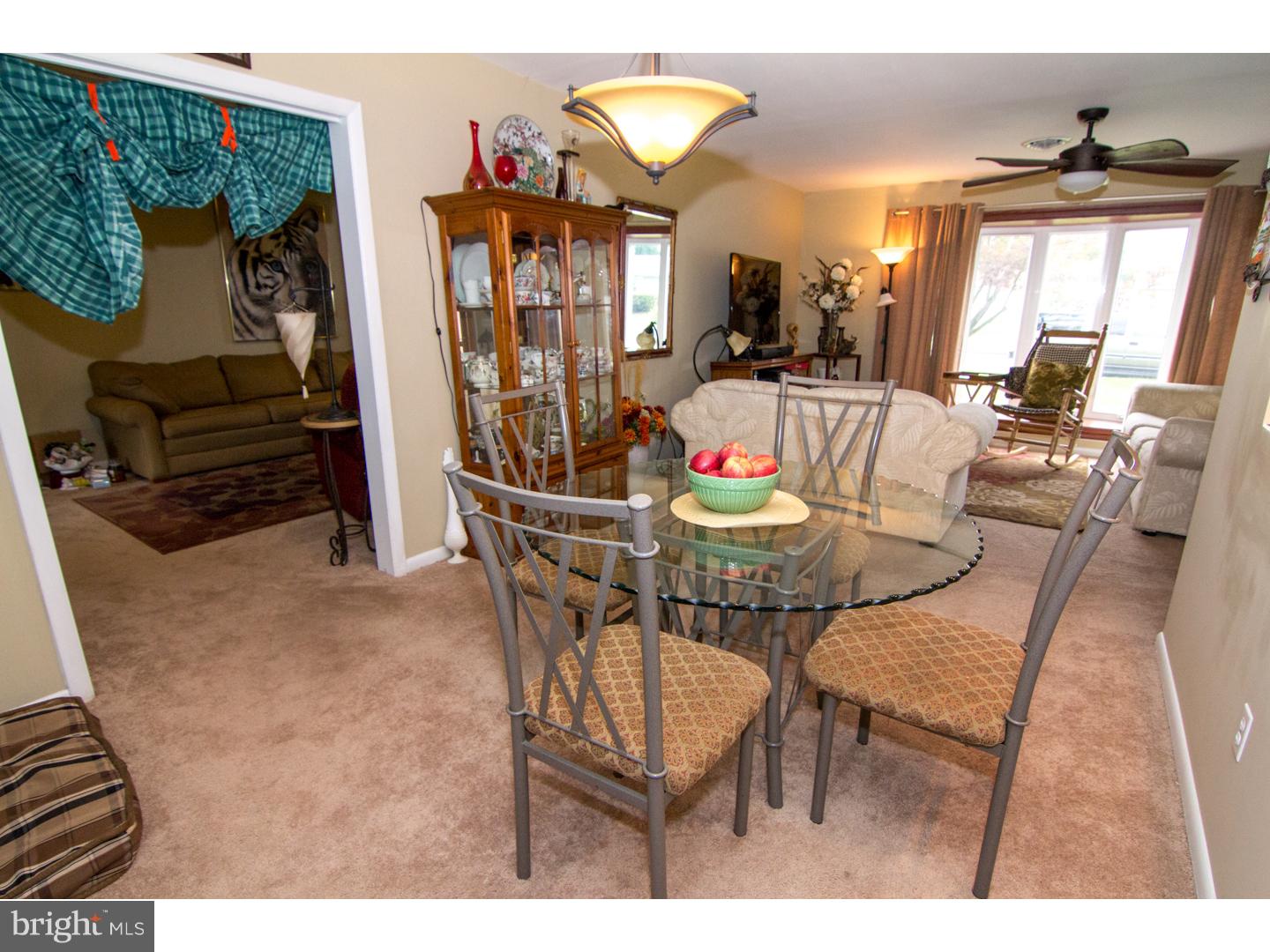 98 Georgia Road Pennsville, NJ 08070 - Photo 6 of 19 a view of a dining room with furniture and a chandelier