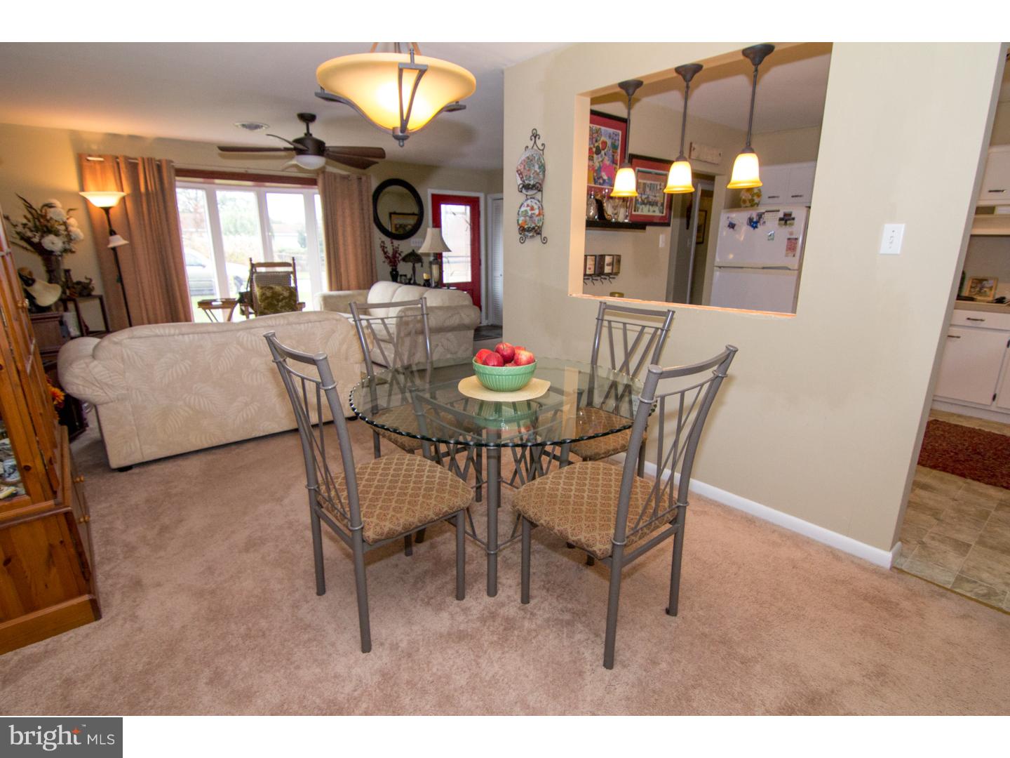 98 Georgia Road Pennsville, NJ 08070 - Photo 7 of 19 a view of a dining room with furniture and a chandelier