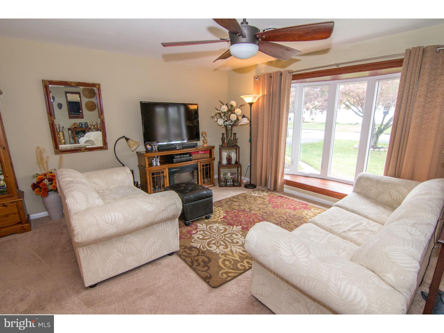 98 Georgia Road Pennsville, NJ 08070 - Photo 8 of 19 a living room with furniture and a flat screen tv