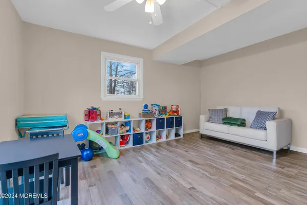 a view of a livingroom with furniture and a flat screen tv