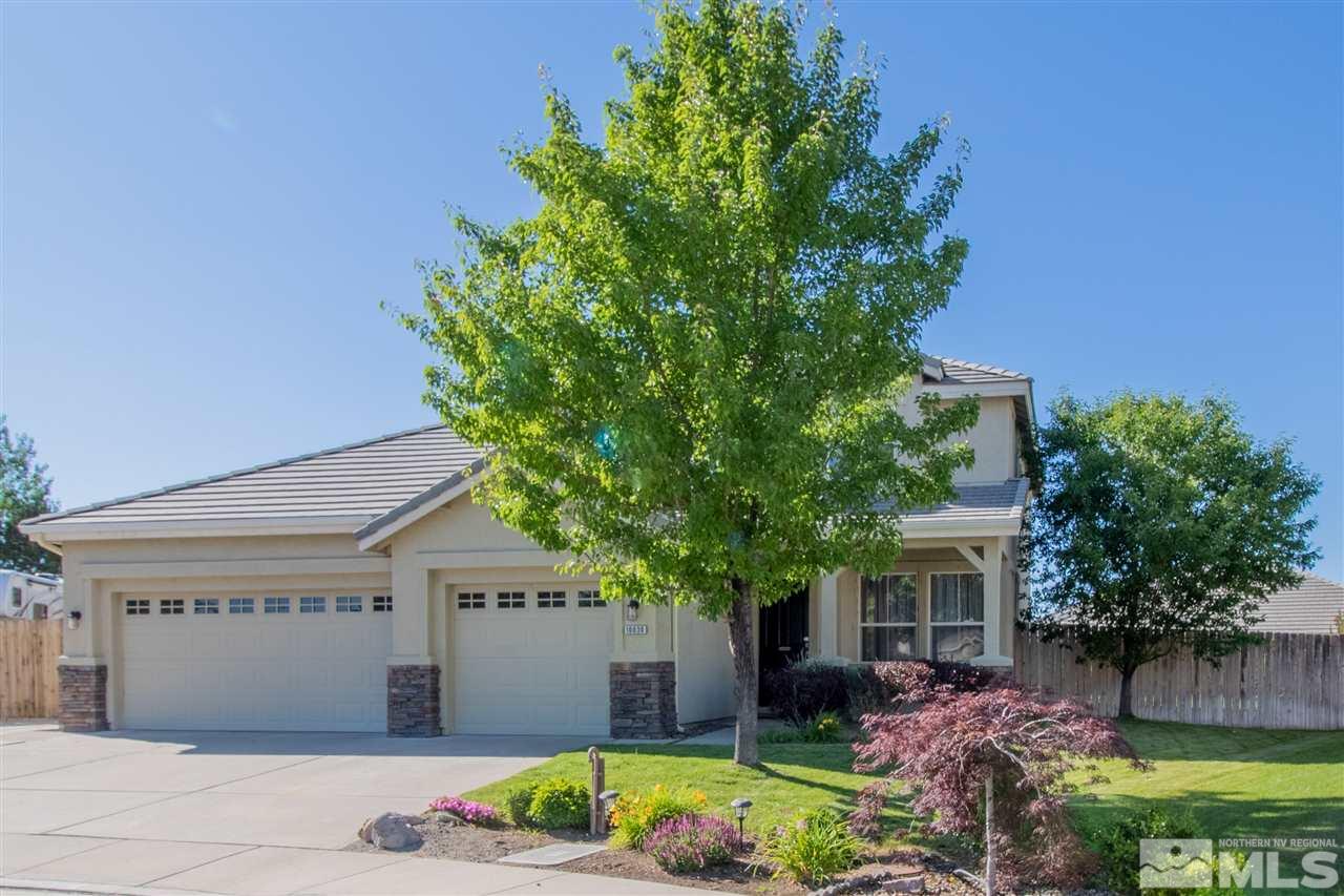 10030 Stonechase Court Reno, NV 89521 - Photo 1 of 24 a front view of a house with a garden