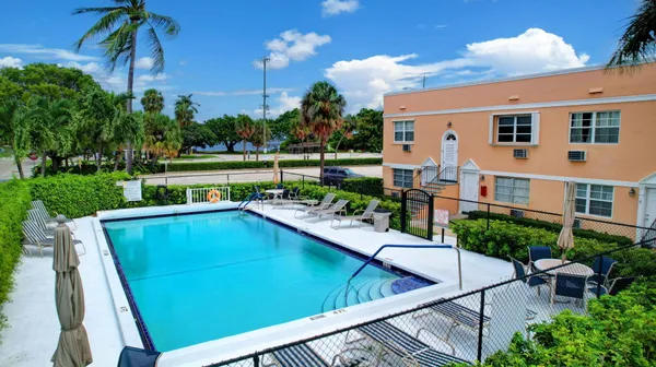 a view of a swimming pool with a patio