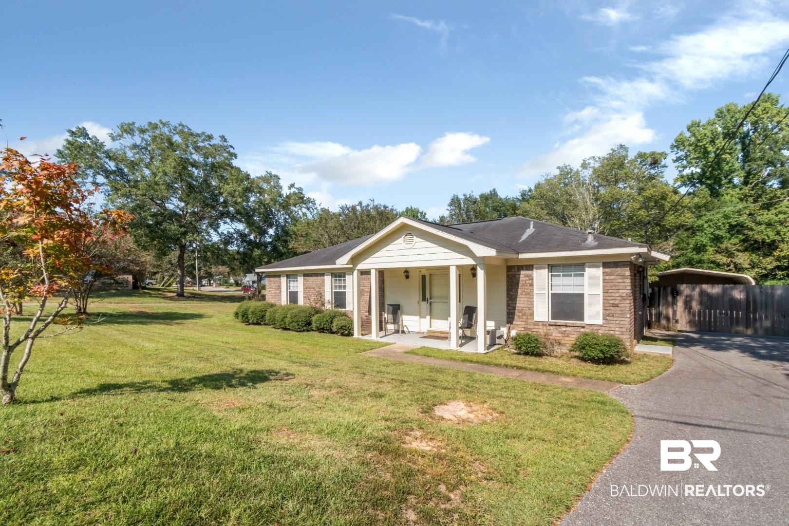 1345 Camden Court Mobile, AL 36695 - Photo 29 of 31 View of front of property featuring brick siding, a front yard, and a porch