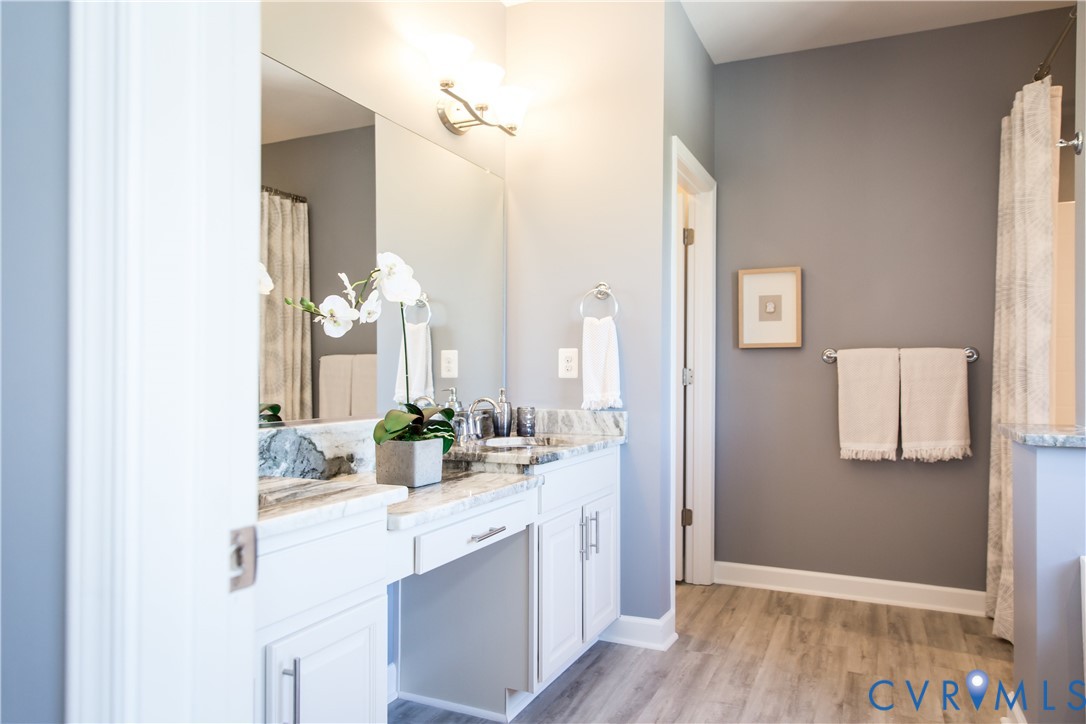 8102 Side Spring Terrace Henrico, VA 23294 - Photo 15 of 20 a bathroom with a double vanity sink and mirror
