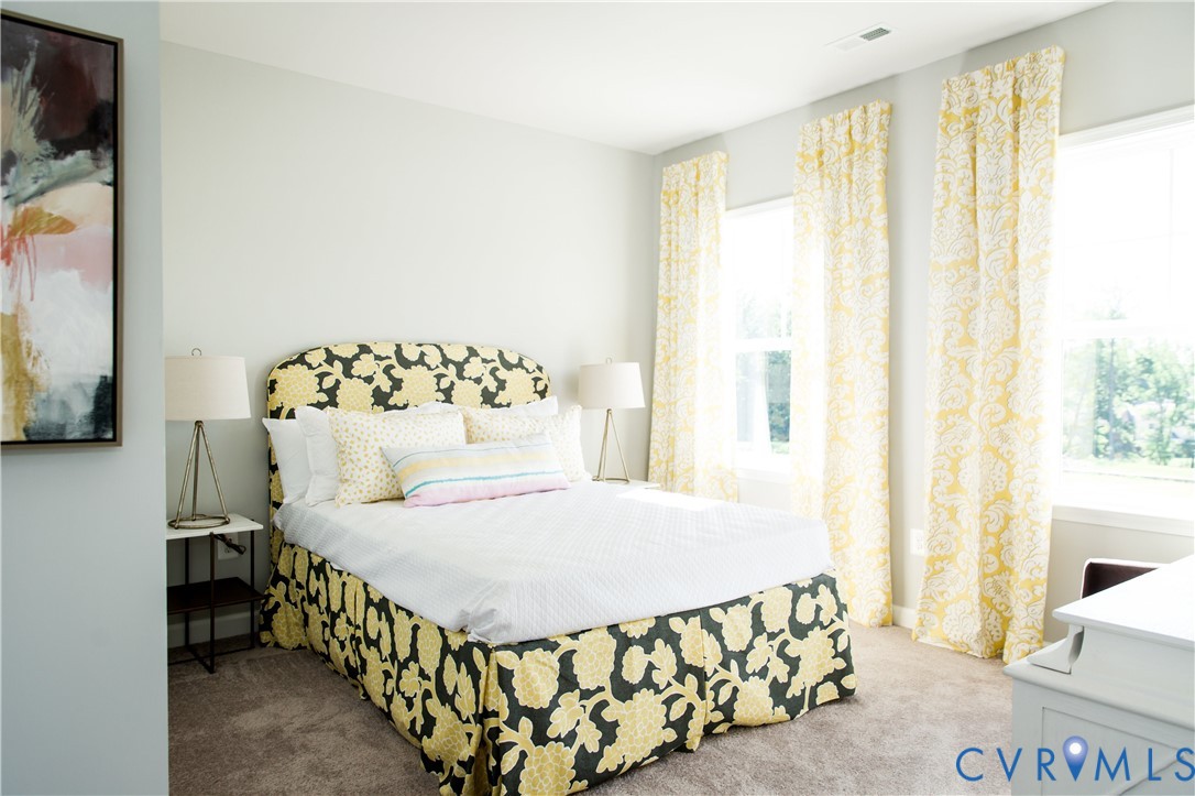 8102 Side Spring Terrace Henrico, VA 23294 - Photo 18 of 20 a bedroom with a bed and a window