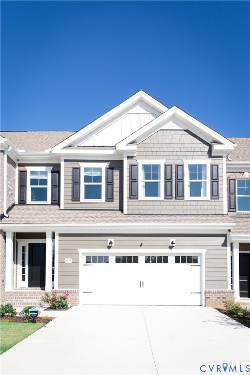 8102 Side Spring Terrace Henrico, VA 23294 - Photo 2 of 20 a front view of a house with a garage
