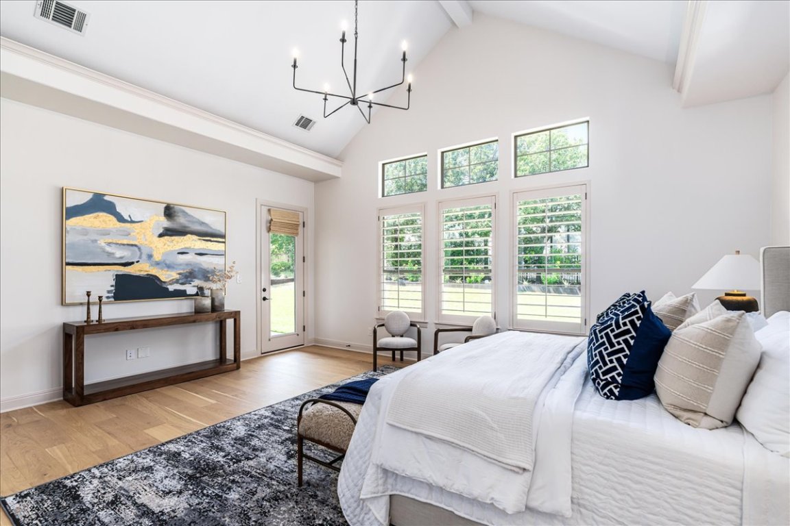 213 Black Wolf Run Austin, TX 78738 - Photo 13 of 39 a bedroom with a bed furniture and window