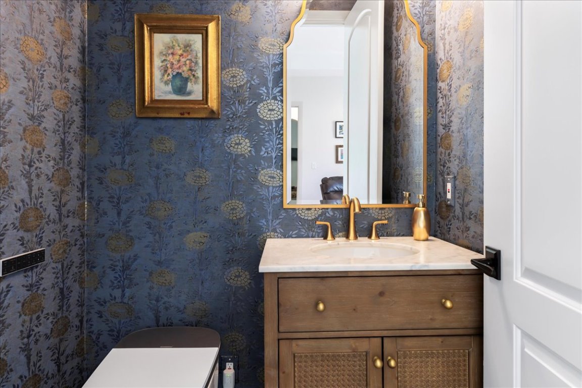 213 Black Wolf Run Austin, TX 78738 - Photo 18 of 39 a bathroom with a sink and a mirror