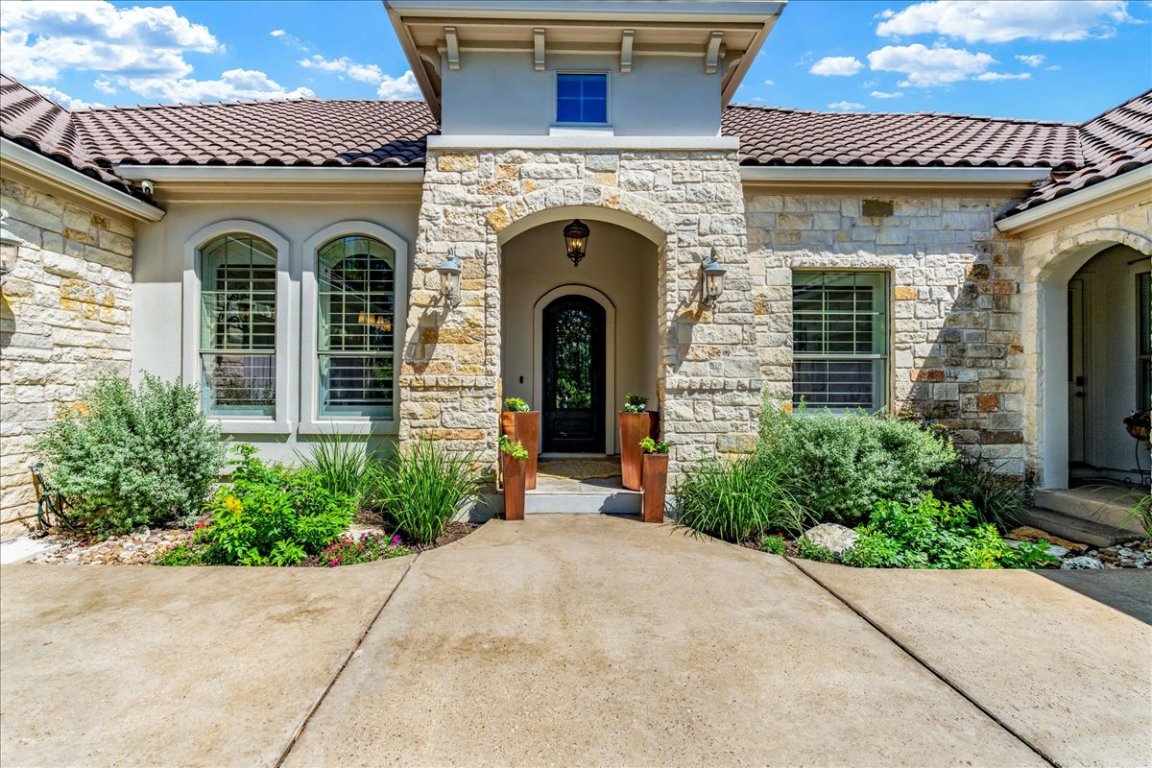 213 Black Wolf Run Austin, TX 78738 - Photo 24 of 39 a view of a house with outdoor space and windows