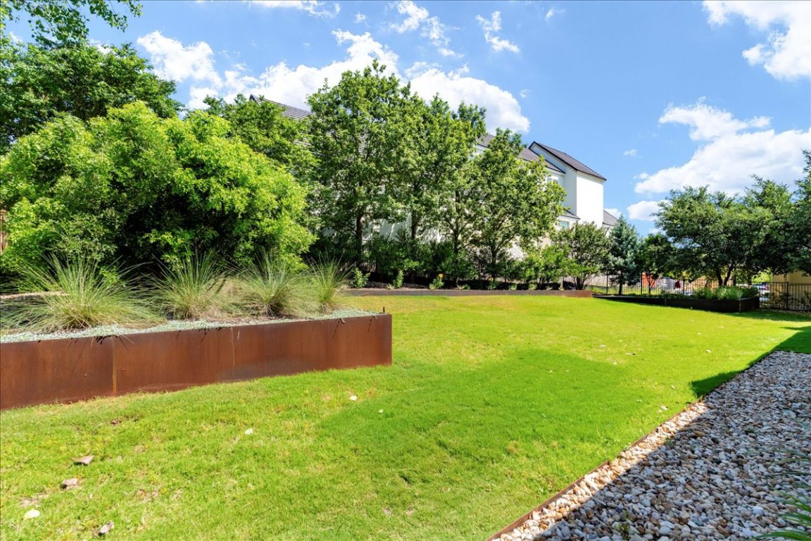 213 Black Wolf Run Austin, TX 78738 - Photo 26 of 39 a view of yard with swimming pool and green space
