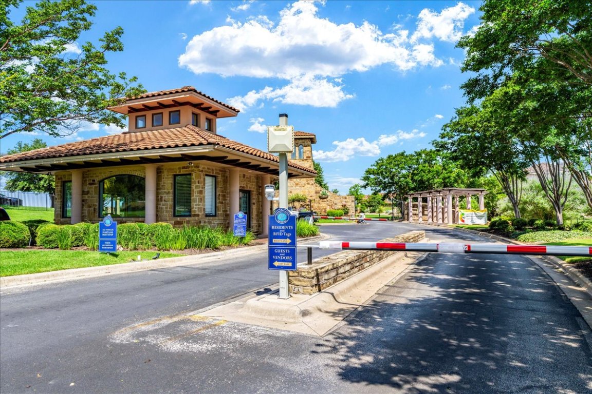 213 Black Wolf Run Austin, TX 78738 - Photo 36 of 39 a front view of a house with a yard