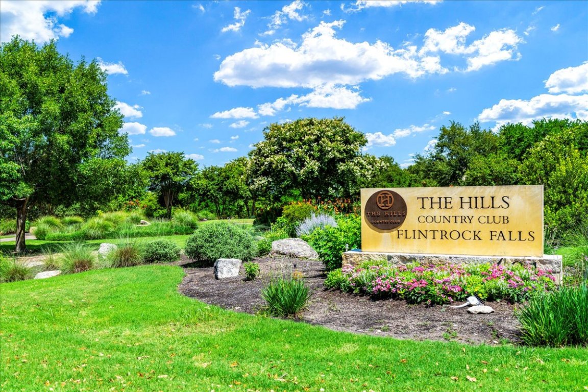 213 Black Wolf Run Austin, TX 78738 - Photo 37 of 39 a sign that is sitting in front of a large tree