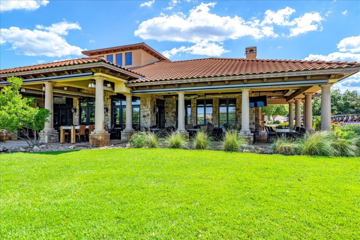 213 Black Wolf Run Austin, TX 78738 - Photo 38 of 39 a view of a building with a garden and sitting area