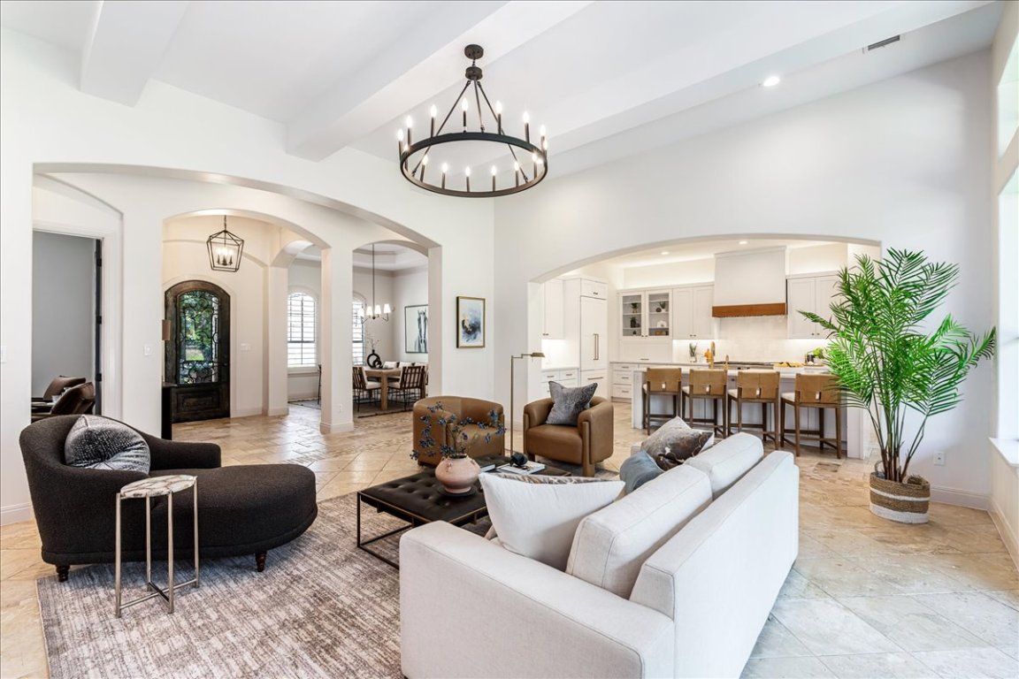 213 Black Wolf Run Austin, TX 78738 - Photo 4 of 39 a living room with furniture potted plant and a large window