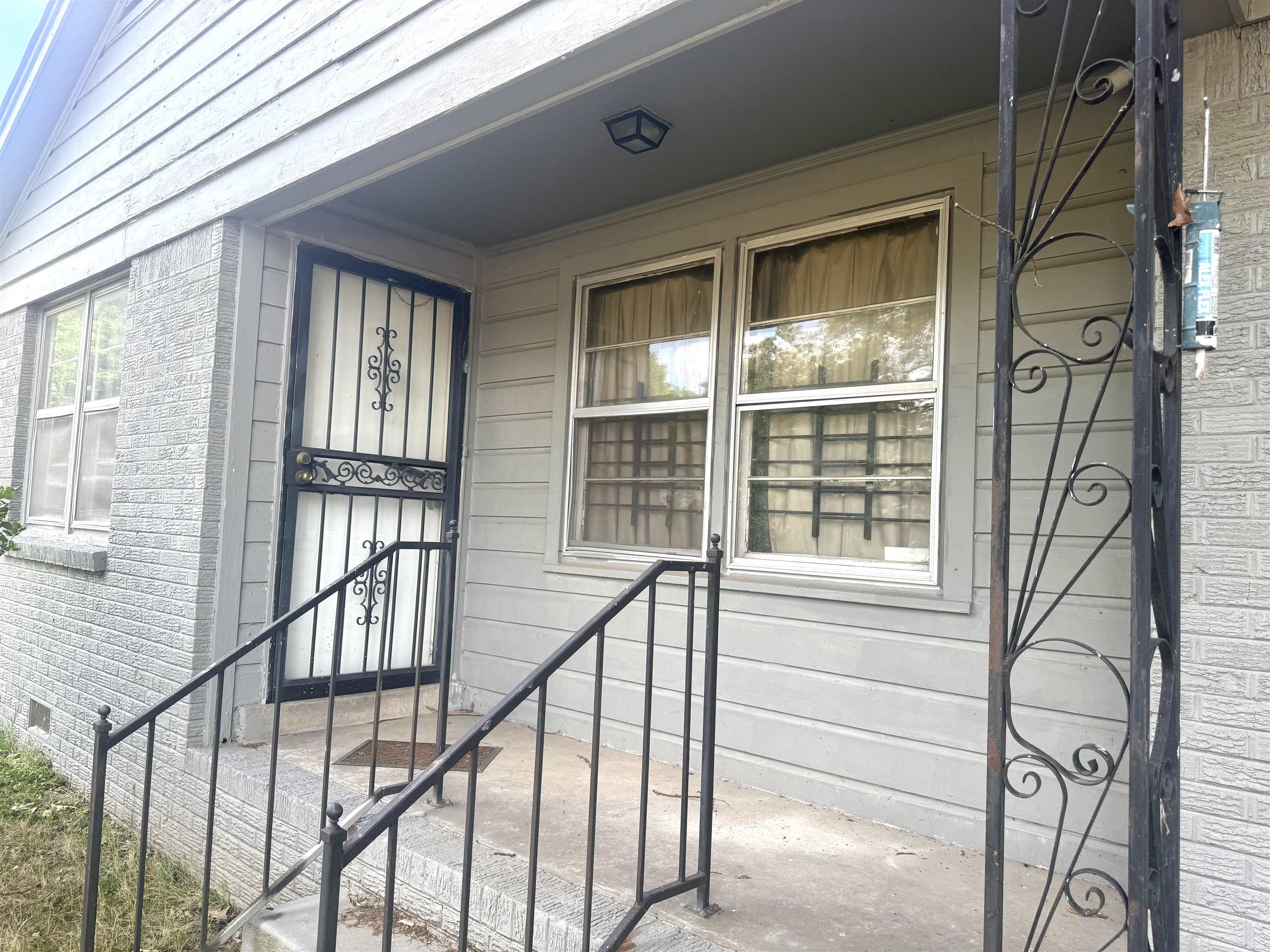 2930 Getwell Road Memphis, TN 38118 - Photo 2 of 25 Front entry featuring a security screen door and wrought iron railings
