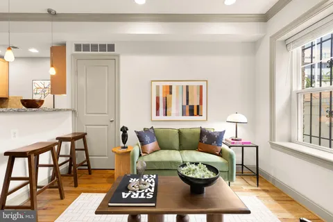 a living room with furniture and a rug