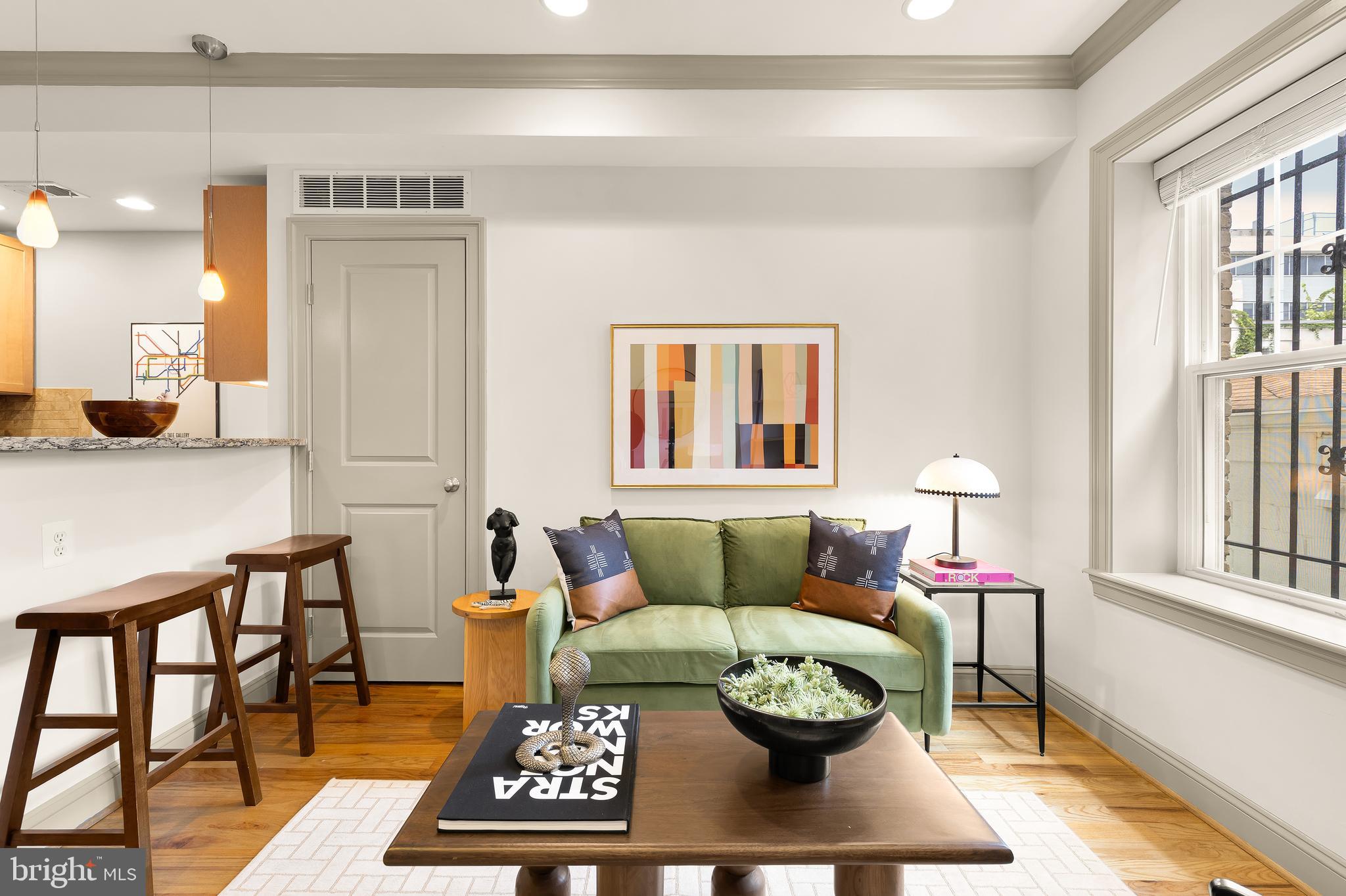 a living room with furniture and a rug