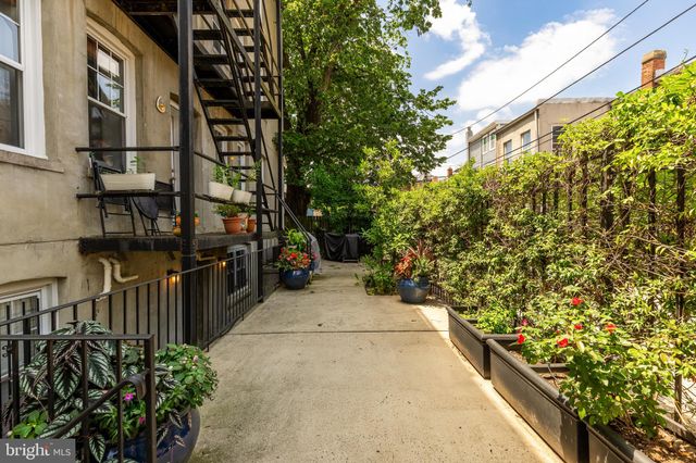 a view of path along with house and trees