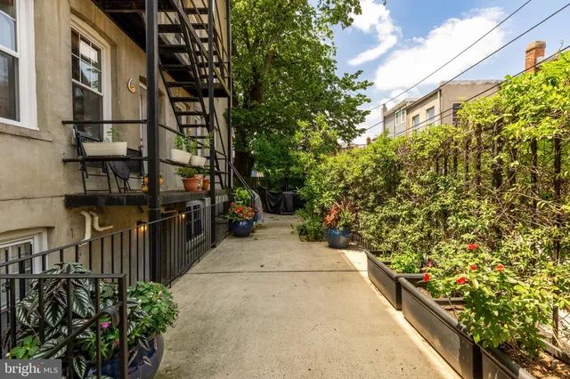 a view of path along with house and trees