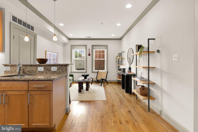 a open kitchen with sink cabinets and wooden floor