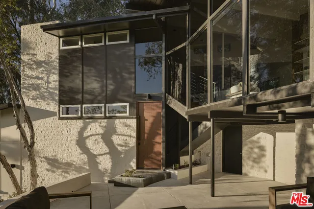 a front view of a house with parking