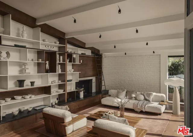 a living room with furniture and a floor to ceiling window