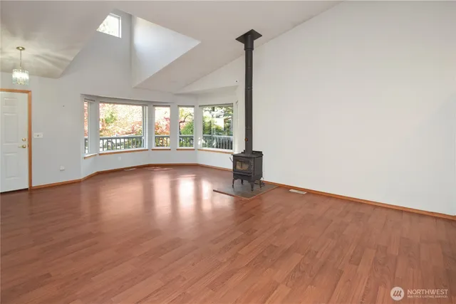 an empty room with large windows