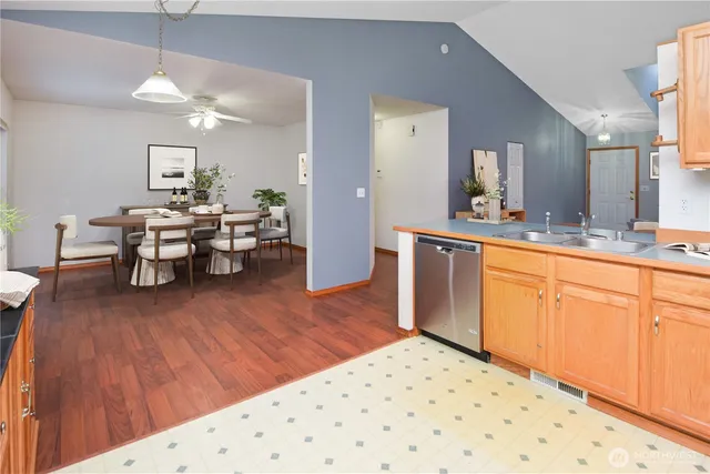 a view of a kitchen with wooden floor