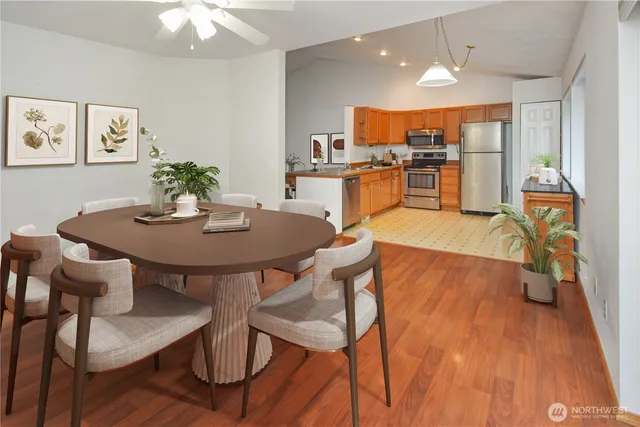 a bathroom with a sink toilet vanity and shower