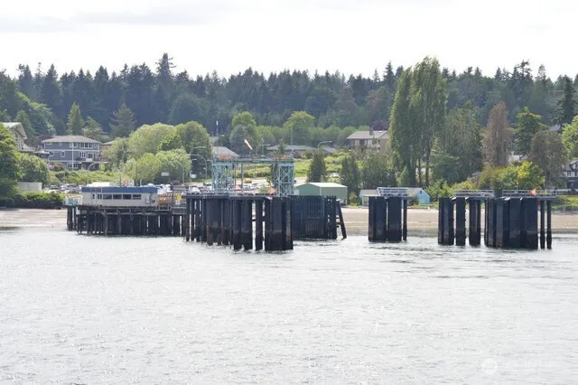 a view of balcony with couple of cars parked