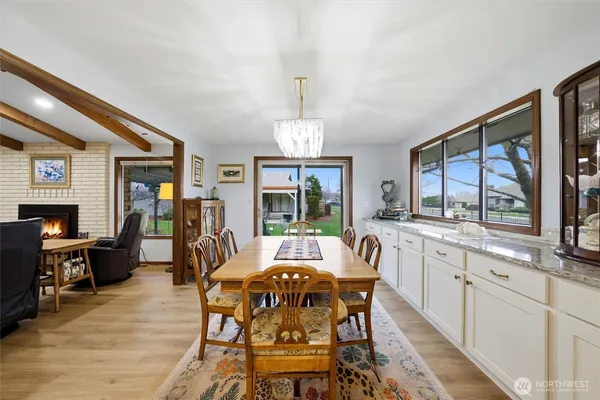 a view of a dining room with furniture window and wooden floor