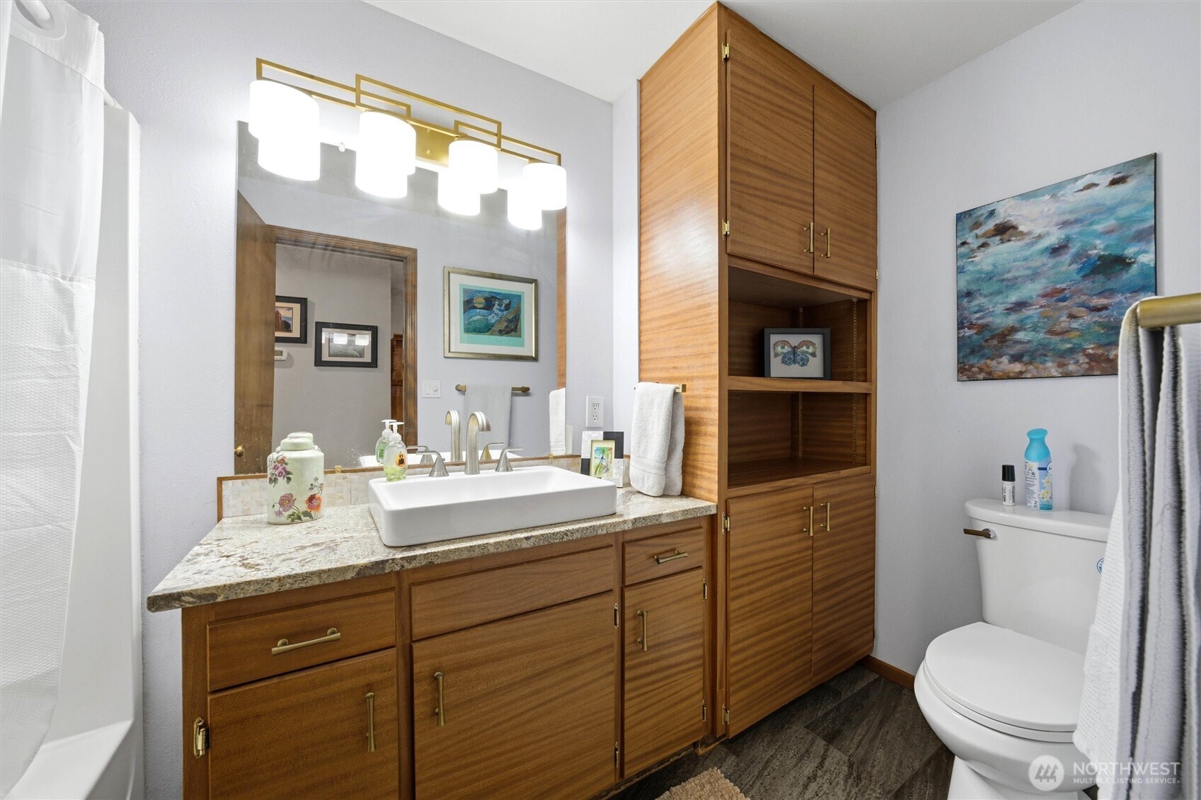 1390 Highland Road Walla Walla, WA 99362 - Photo 17 of 40 a bathroom with a granite countertop toilet sink and mirror