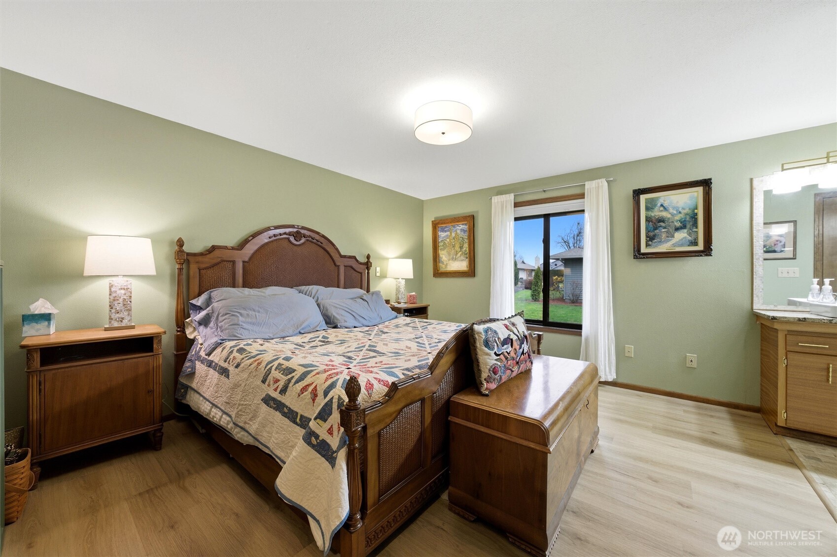 1390 Highland Road Walla Walla, WA 99362 - Photo 21 of 40 a bedroom with a bed and wooden floor