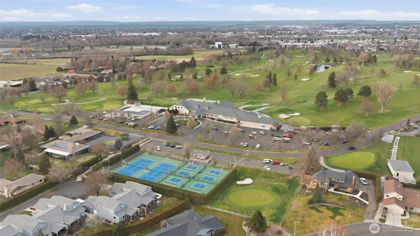 an aerial view of residential houses with outdoor space