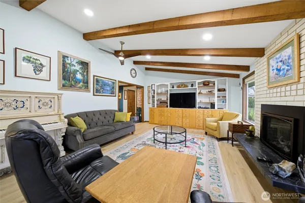 a living room with furniture or couch and a fireplace