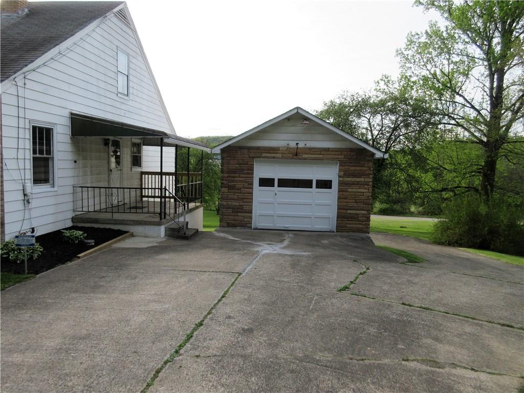 113 Ford City Road Freeport, PA 16229 - Photo 3 of 25 The covered side porch is 15x7'. The cement driveway offers plenty of parking and the detached garage has one parking space, but there is a lower level in this garage offering a 2nd parking space, which you enter from the back of the property.