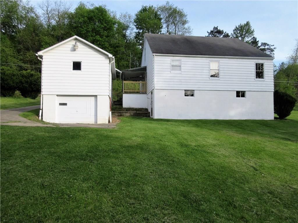 113 Ford City Road Freeport, PA 16229 - Photo 21 of 25 Back view of home and garage,both with freshly painted block.