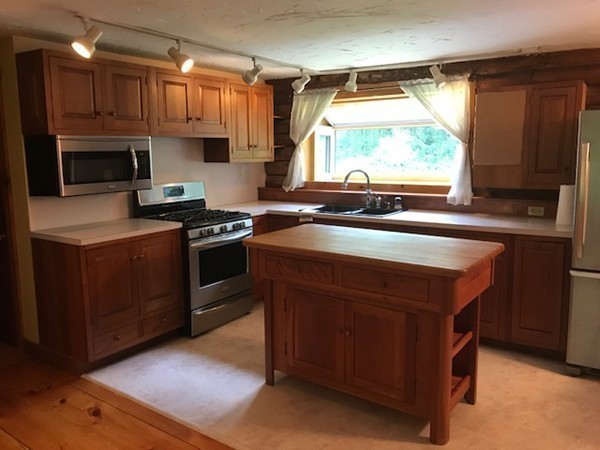 970 Bearsden Road Athol, MA 01331 - Photo 16 of 30 a kitchen with kitchen island granite countertop a sink a counter top space stainless steel appliances and a window