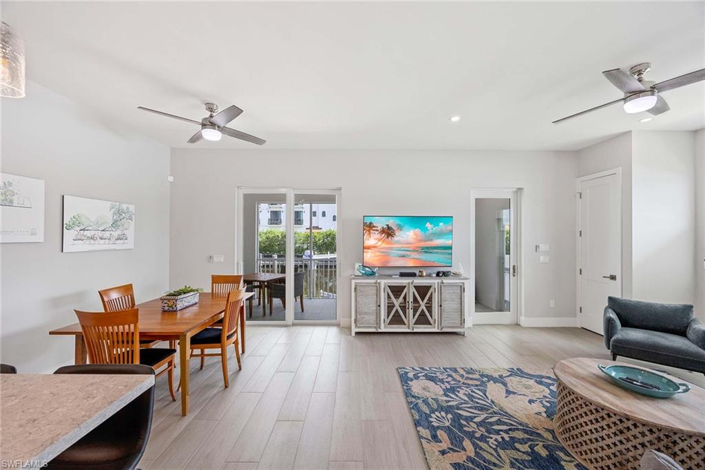 1395 Curlew Avenue, Unit 43 Naples, FL 34102 - Photo 8 of 24 a living room with furniture and a flat screen tv