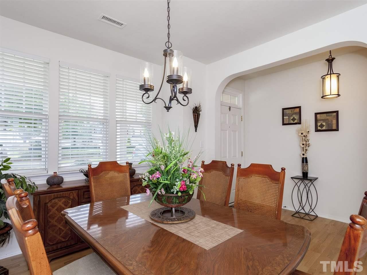 8506 Slabstone Court Raleigh, NC 27613 - Photo 5 of 25 a dining room with furniture and window