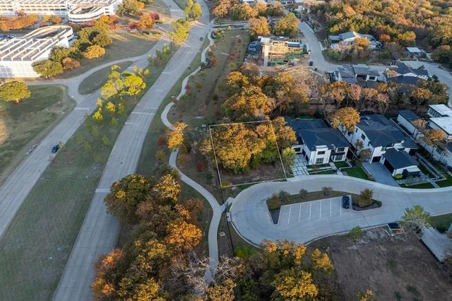 a view of a street with a building in the background