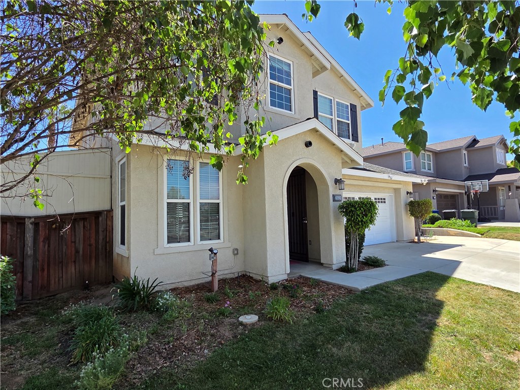 20329 Red Poppy Lane Riverside, CA 92508 - Photo 2 of 24 a front view of a house with garden