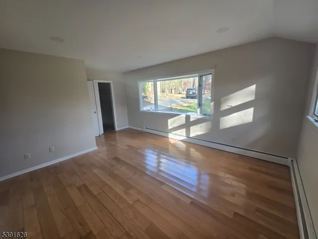 a view of an empty room and window