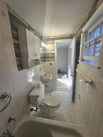 a view of road with large trees