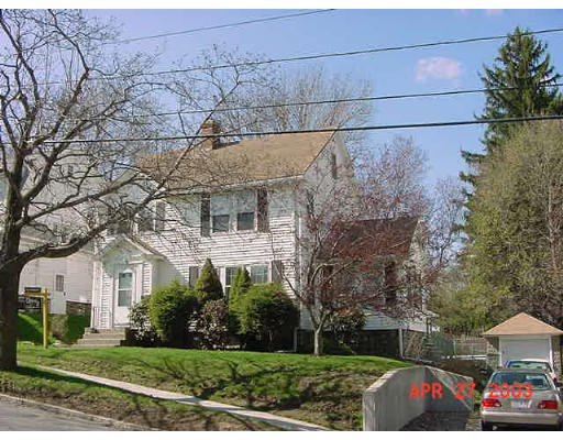 9 Rexhame Road Worcester, MA 01606 - Photo 1 of 1 a front view of a house with a yard