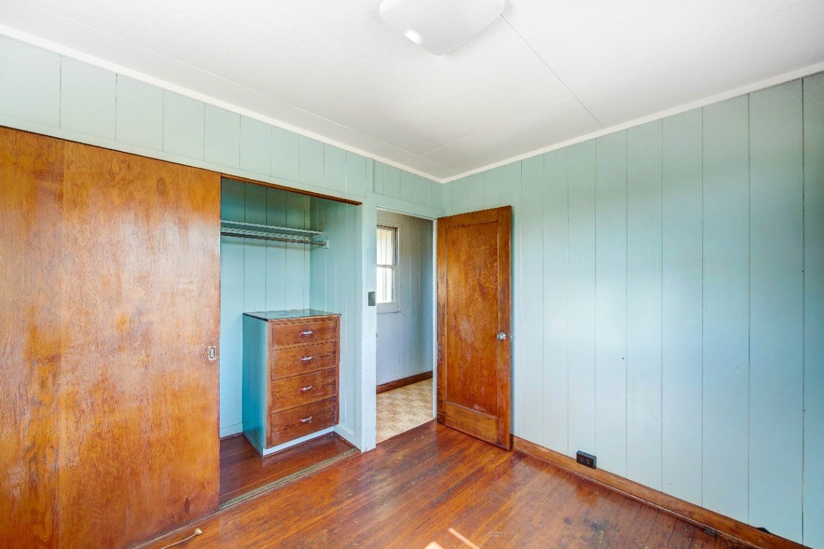 4733 Uliuli Road Eleele, HI 96705 - Photo 13 of 25 an empty room with wooden floor and closet