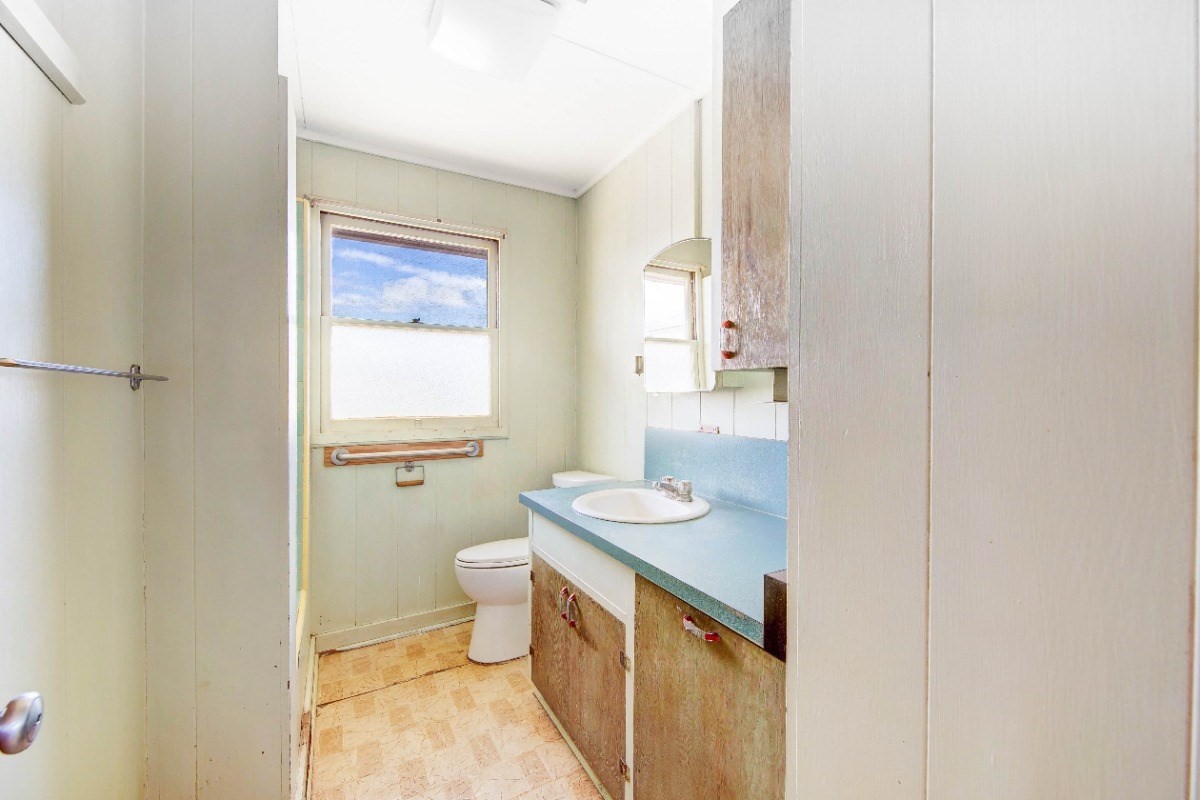 4733 Uliuli Road Eleele, HI 96705 - Photo 16 of 25 a bathroom with a sink a toilet and shower