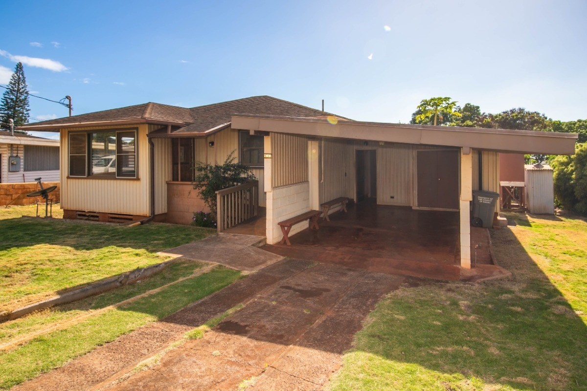 4733 Uliuli Road Eleele, HI 96705 - Photo 3 of 25 a view of a house with a yard and balcony
